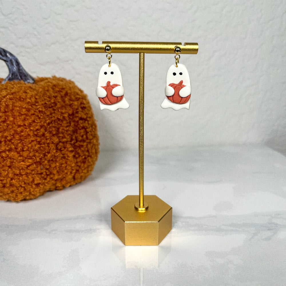 white ghost holding pumpkin clay earring